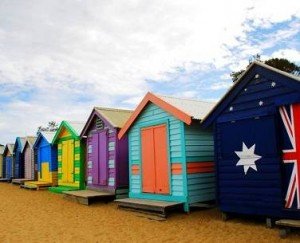 Different colour changing huts on a beach